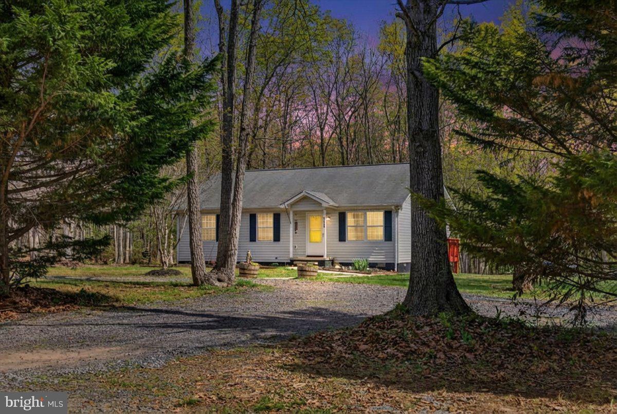 6265 Browning Road Culpeper, VA 22701 - Photo 4 of 74 a front view of a house with a yard