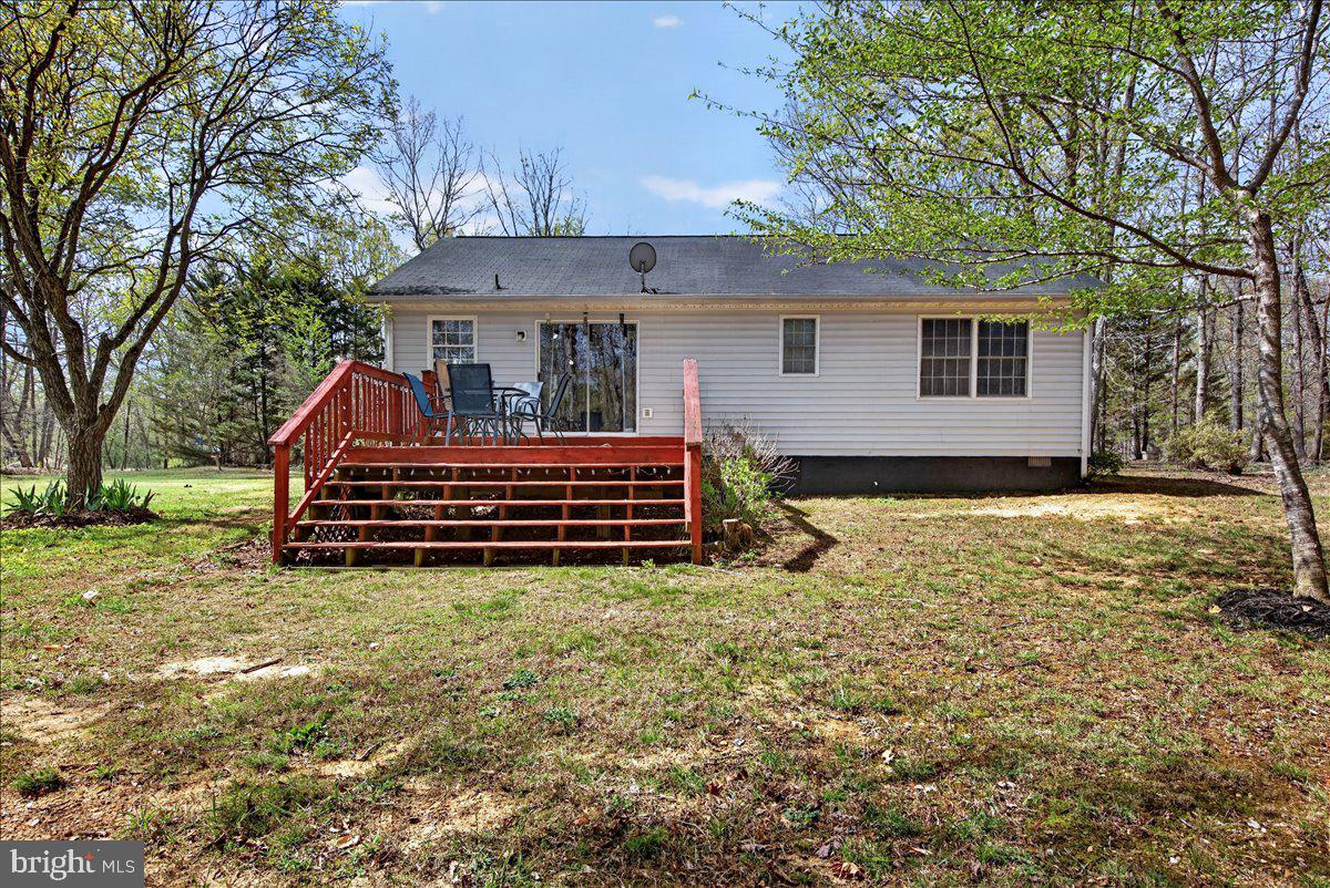 6265 Browning Road Culpeper, VA 22701 - Photo 44 of 74 a backyard of a house with barbeque oven and trees