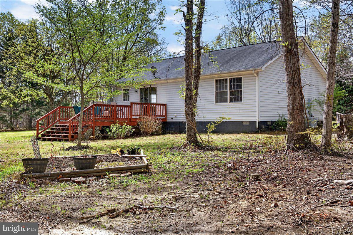6265 Browning Road Culpeper, VA 22701 - Photo 53 of 74 a view of a house with a yard covered in the forest