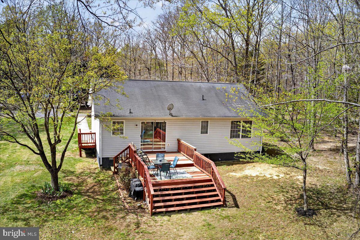 6265 Browning Road Culpeper, VA 22701 - Photo 59 of 74 a front view of a house with a yard table and chairs