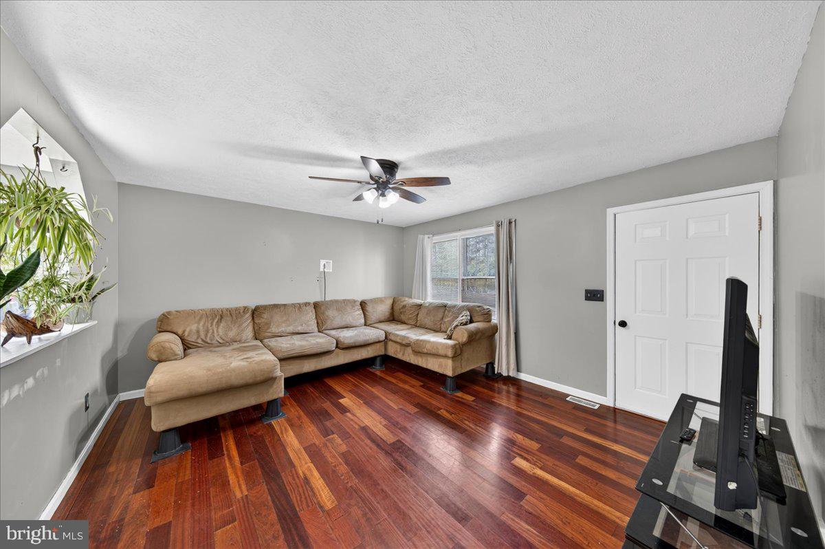 6265 Browning Road Culpeper, VA 22701 - Photo 6 of 74 a living room with furniture and a flat screen tv