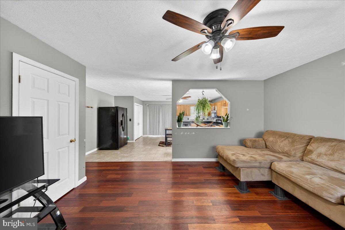 6265 Browning Road Culpeper, VA 22701 - Photo 8 of 74 a living room with furniture and a flat screen tv