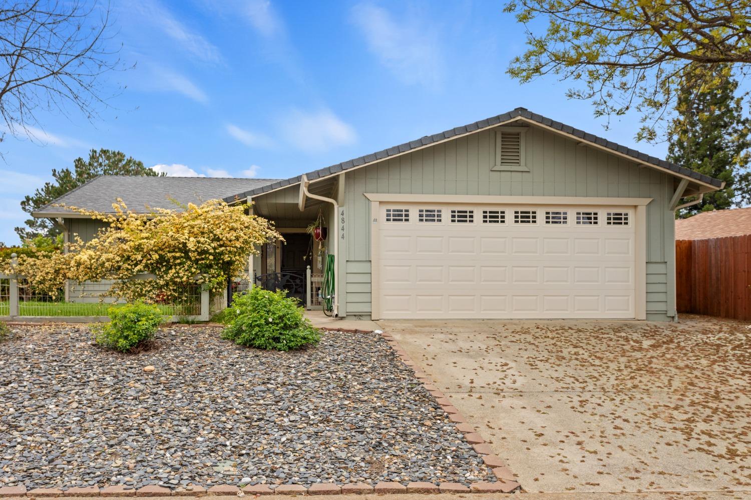a house with trees in the background