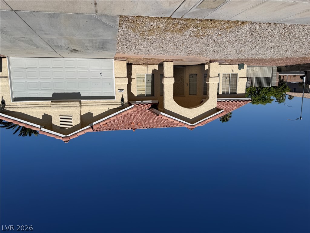 5364 Rhett Street Las Vegas, NV 89130 - Photo 1 of 1 A terracotta-tiled roof crowns this residence with an integrated garage and arched entry.