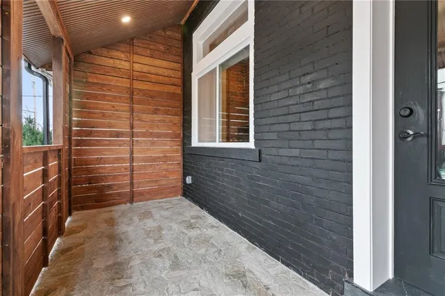 a living room with furniture wooden floor and a fireplace