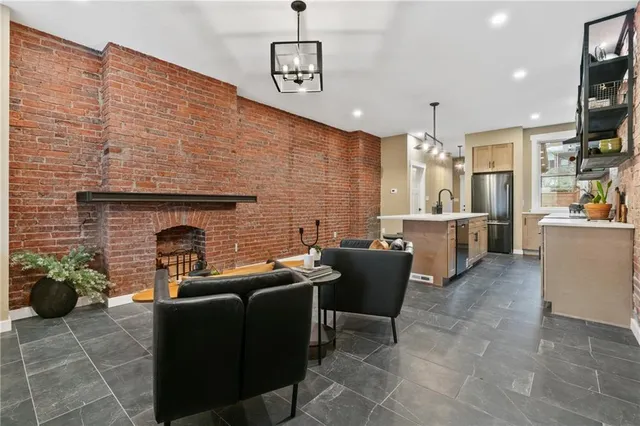 a outdoor living space with furniture and a fireplace