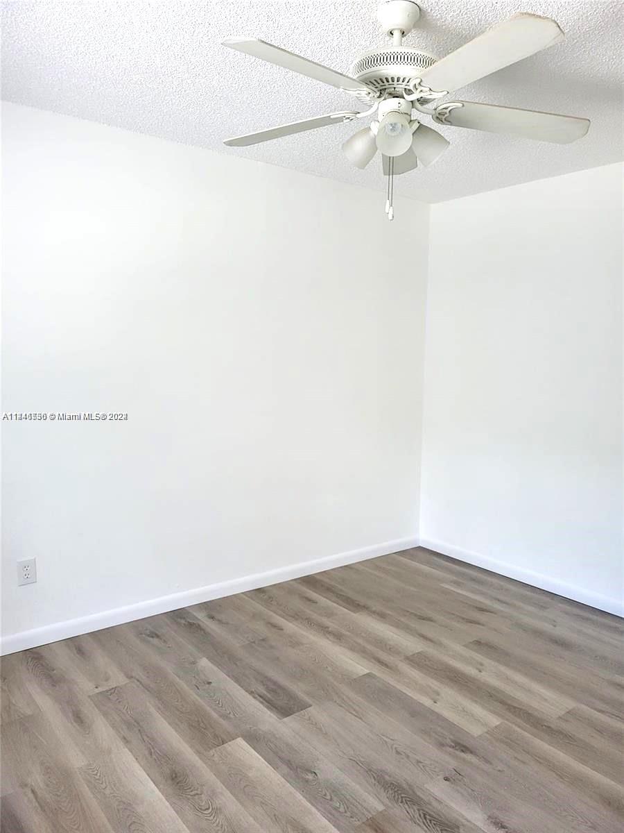 1755 Northeast 116th Road, Unit 9 North Miami, FL 33181 - Photo 12 of 27 a view of a room with an empty space