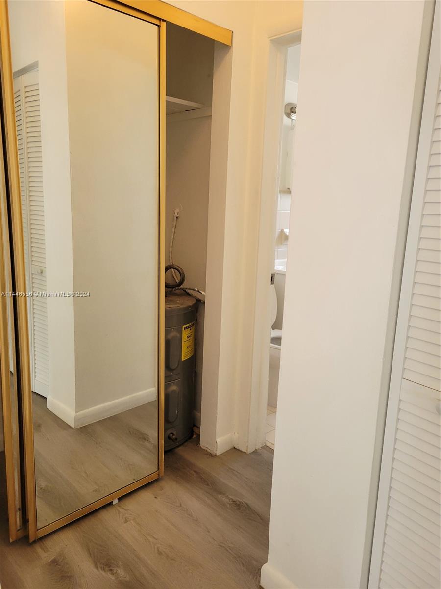 1755 Northeast 116th Road, Unit 9 North Miami, FL 33181 - Photo 15 of 27 an empty room with wooden door