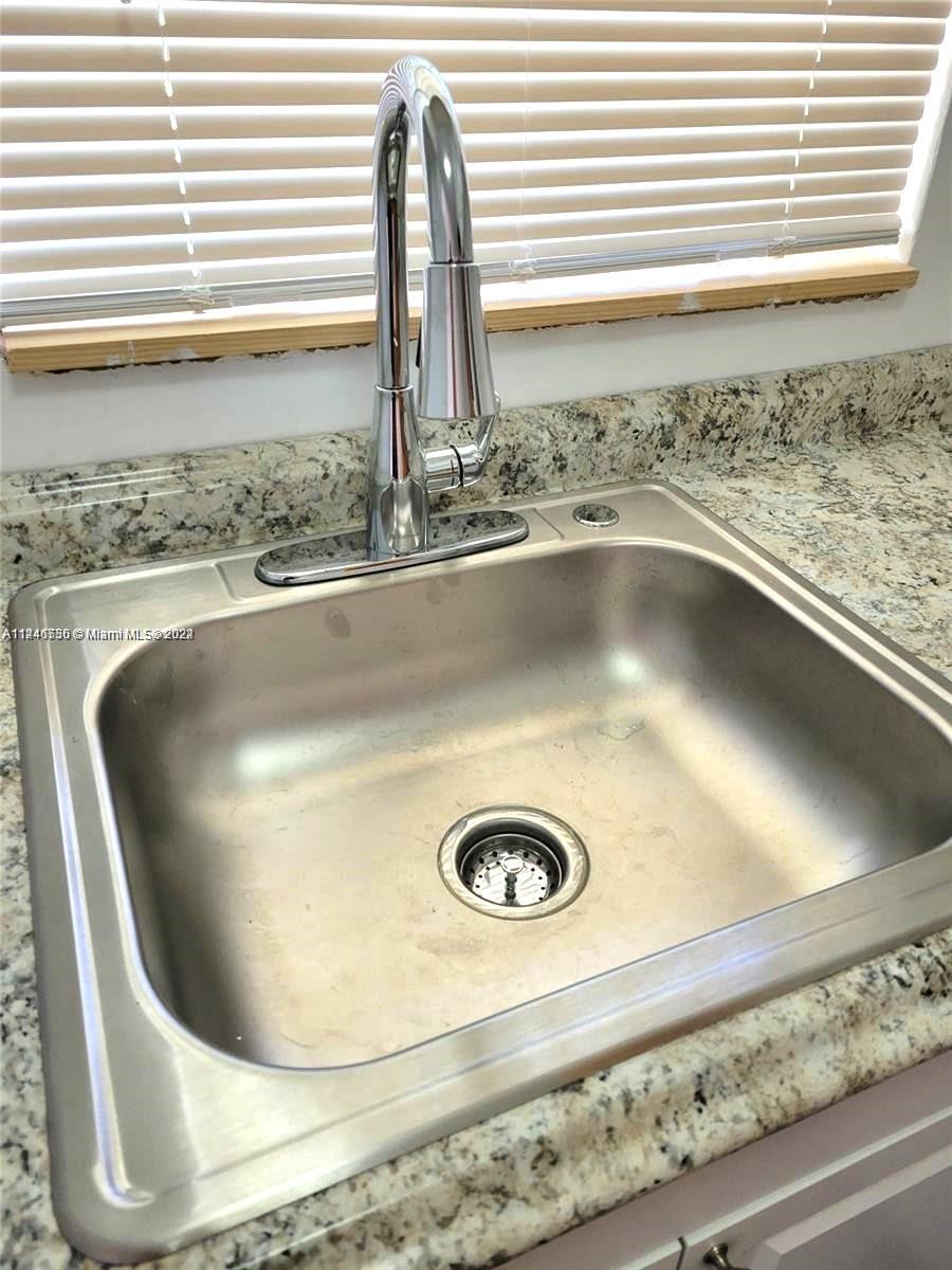1755 Northeast 116th Road, Unit 9 North Miami, FL 33181 - Photo 21 of 27 a view of a sink
