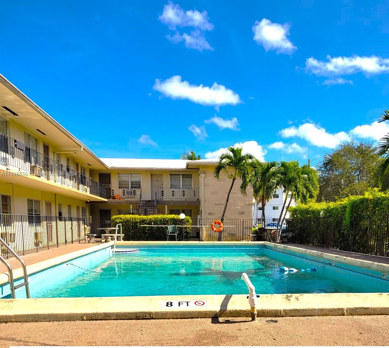 1755 Northeast 116th Road, Unit 9 North Miami, FL 33181 - Photo 25 of 27 a view of a yard with palm trees