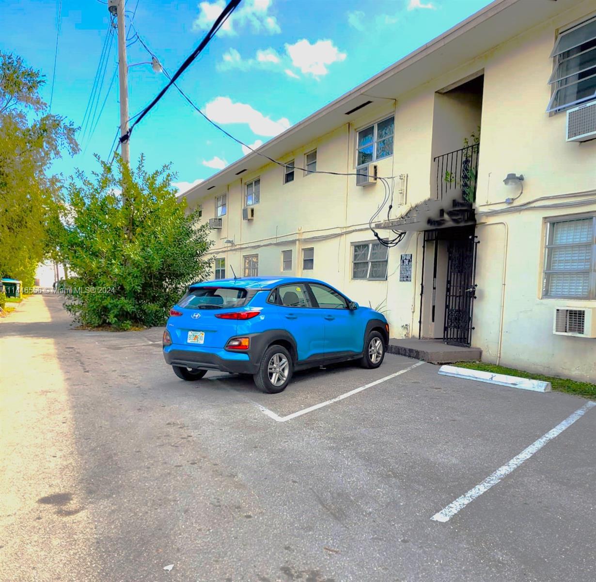 1755 Northeast 116th Road, Unit 9 North Miami, FL 33181 - Photo 27 of 27 a car parked in front of a house