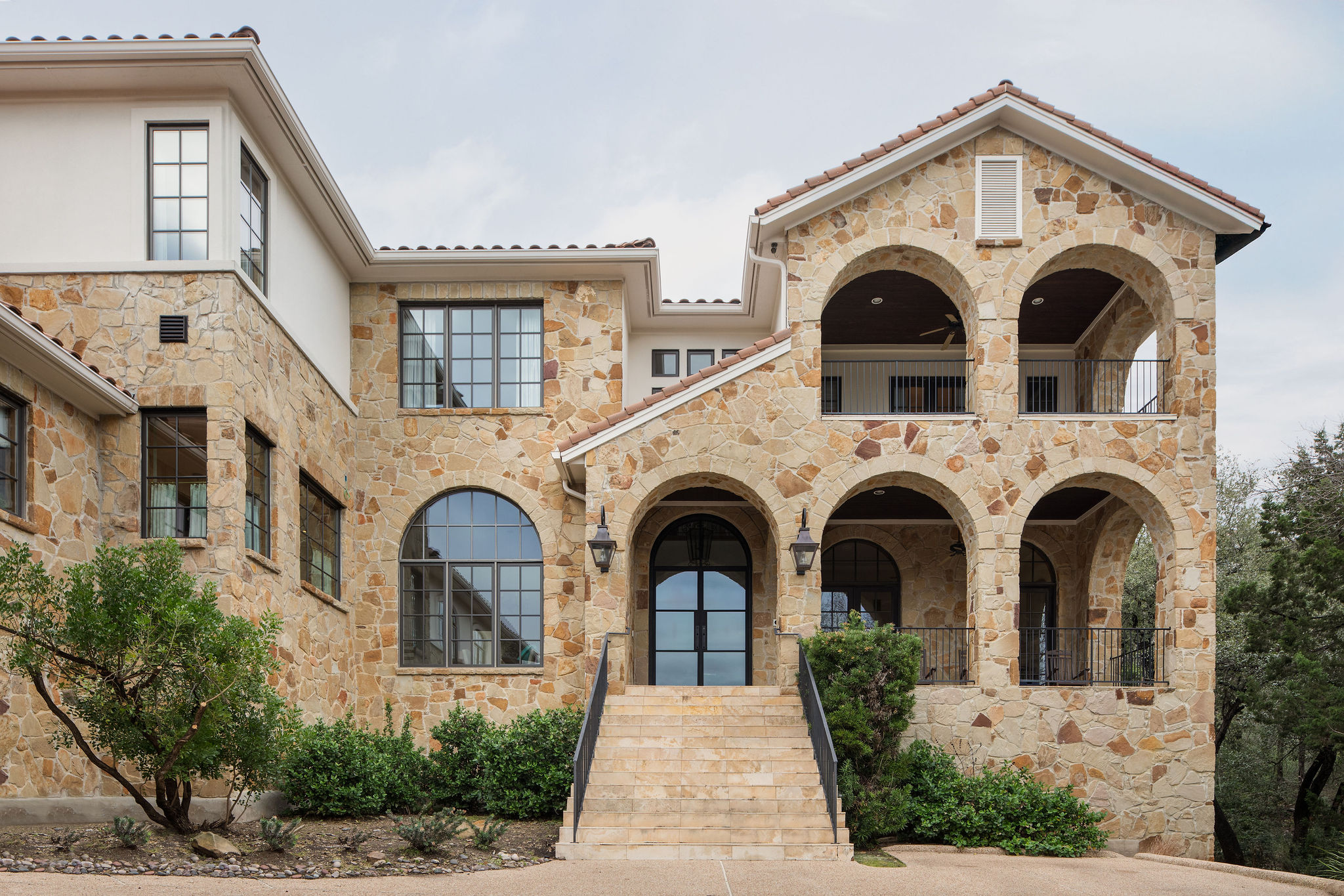 600 Logans Lane Austin, TX 78746 - Photo 36 of 39 a view of a white house with large windows