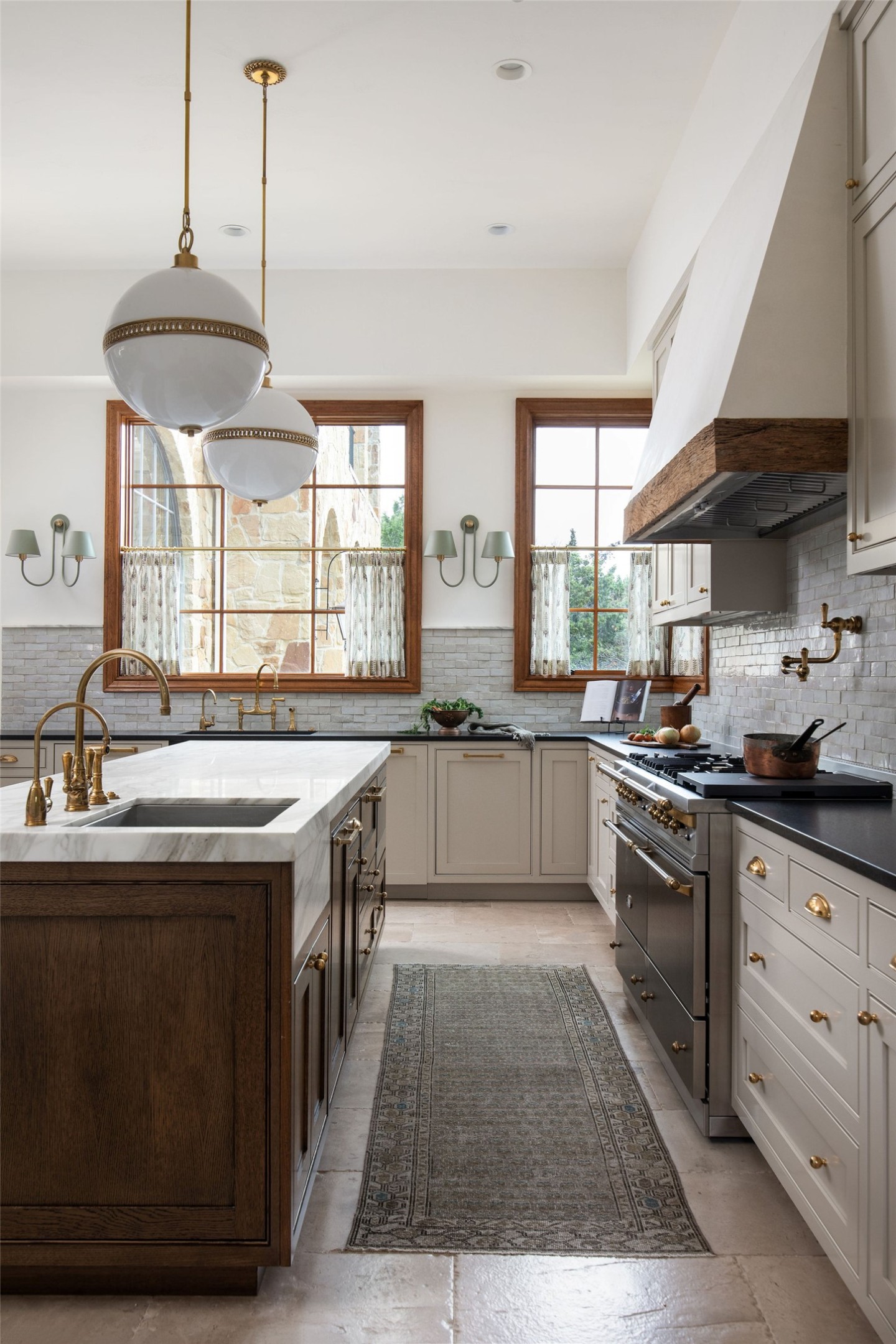 600 Logans Lane Austin, TX 78746 - Photo 4 of 39 a kitchen with stainless steel appliances granite countertop a sink a stove and a wooden floors
