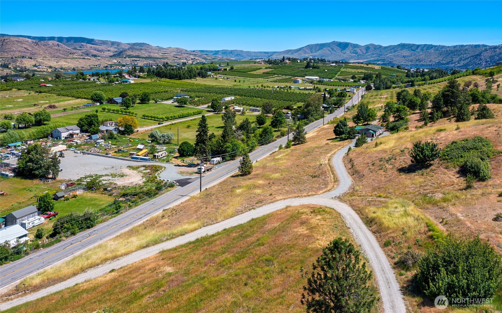 32 Barkley Road Manson, WA 98831 - Photo 15 of 17 a view of a city with mountains in the background