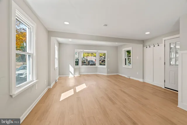 a view of an empty room and a window