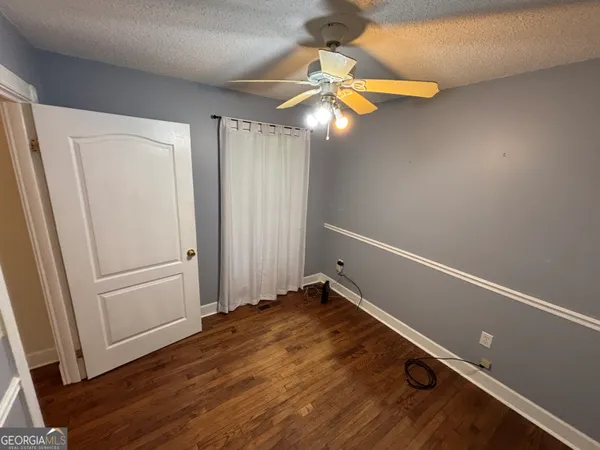 a kitchen with stainless steel appliances granite countertop a refrigerator a stove and a sink