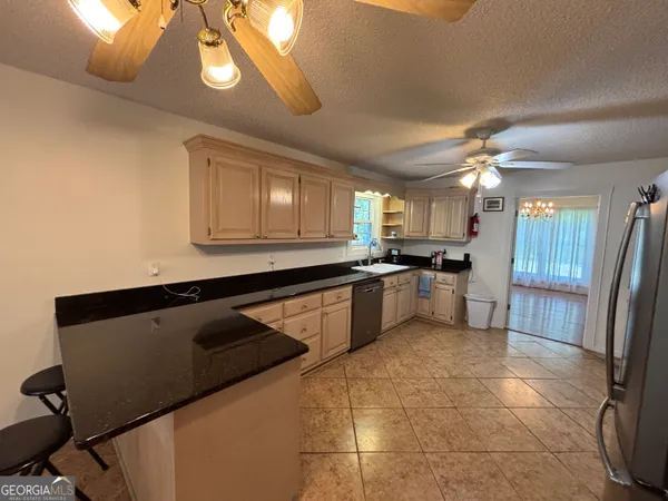a bathroom with a sink a toilet a mirror and vanity