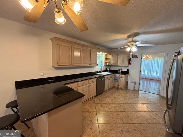 a bathroom with a sink a toilet a mirror and vanity
