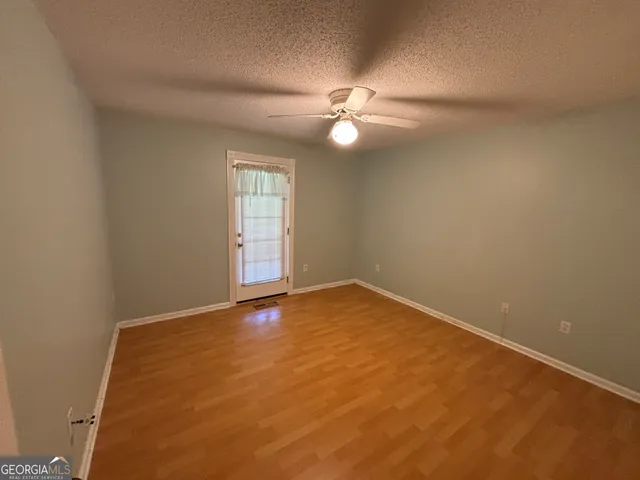 a view of a house with a backyard