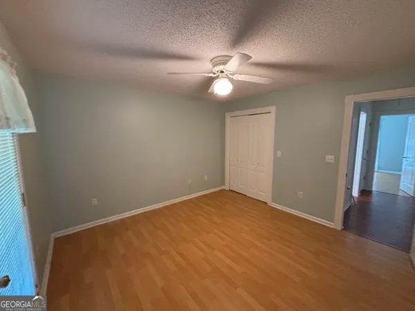 a view of a backyard with hardwood