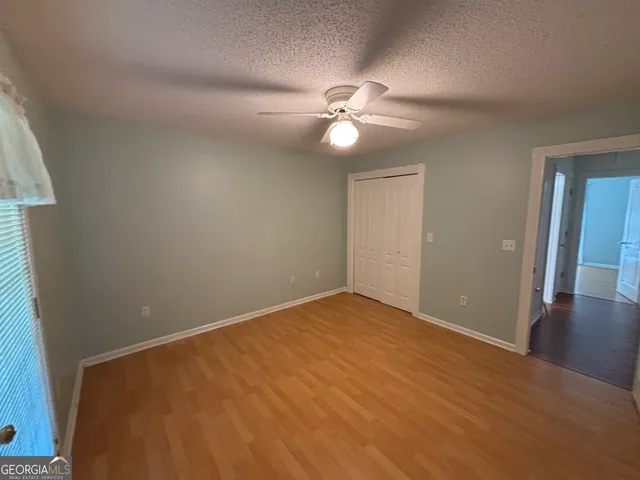 a view of a backyard with hardwood