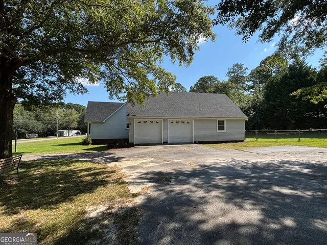 a view of a livingroom with fireplace and furniture