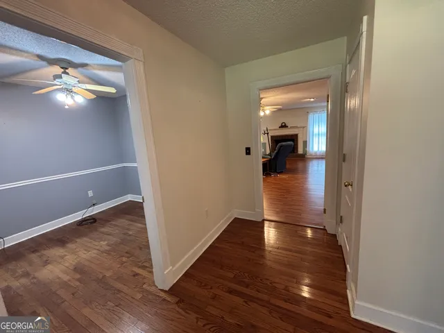 a room with a fireplace and wooden floor