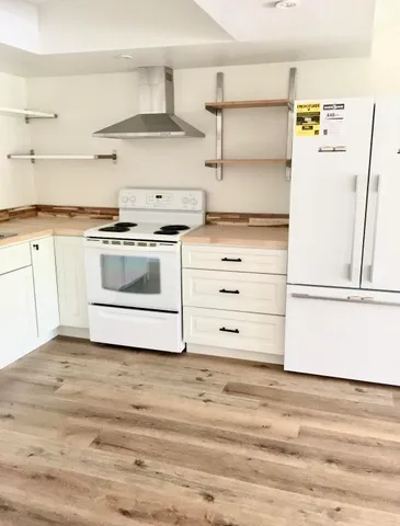 a kitchen with a stove and a refrigerator