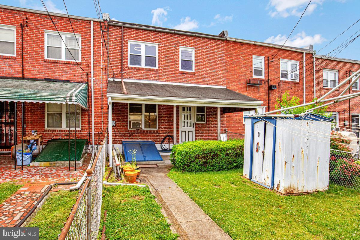 3040 Federal Street Baltimore, MD 21213 - Photo 37 of 41 a front view of a house with garden
