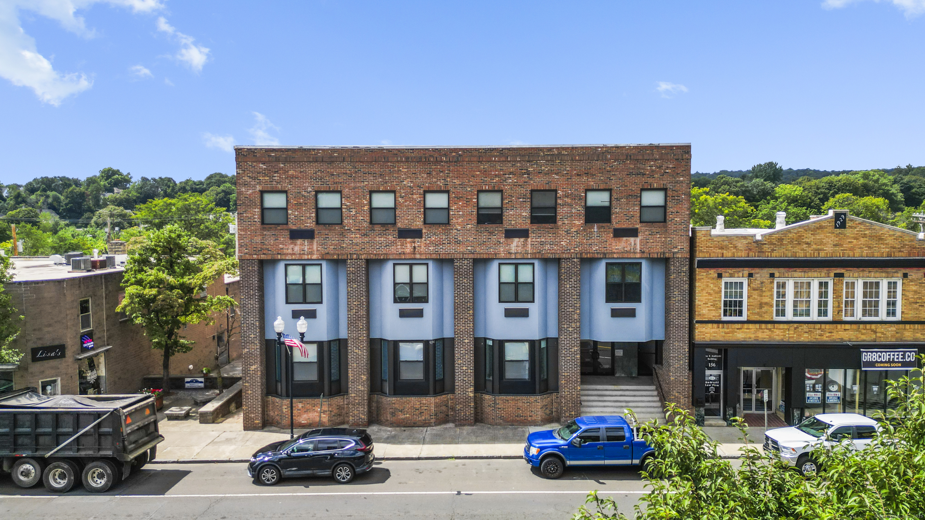158 Main Street Ansonia, CT 06401 - Photo 1 of 26 a car parked in front of a building