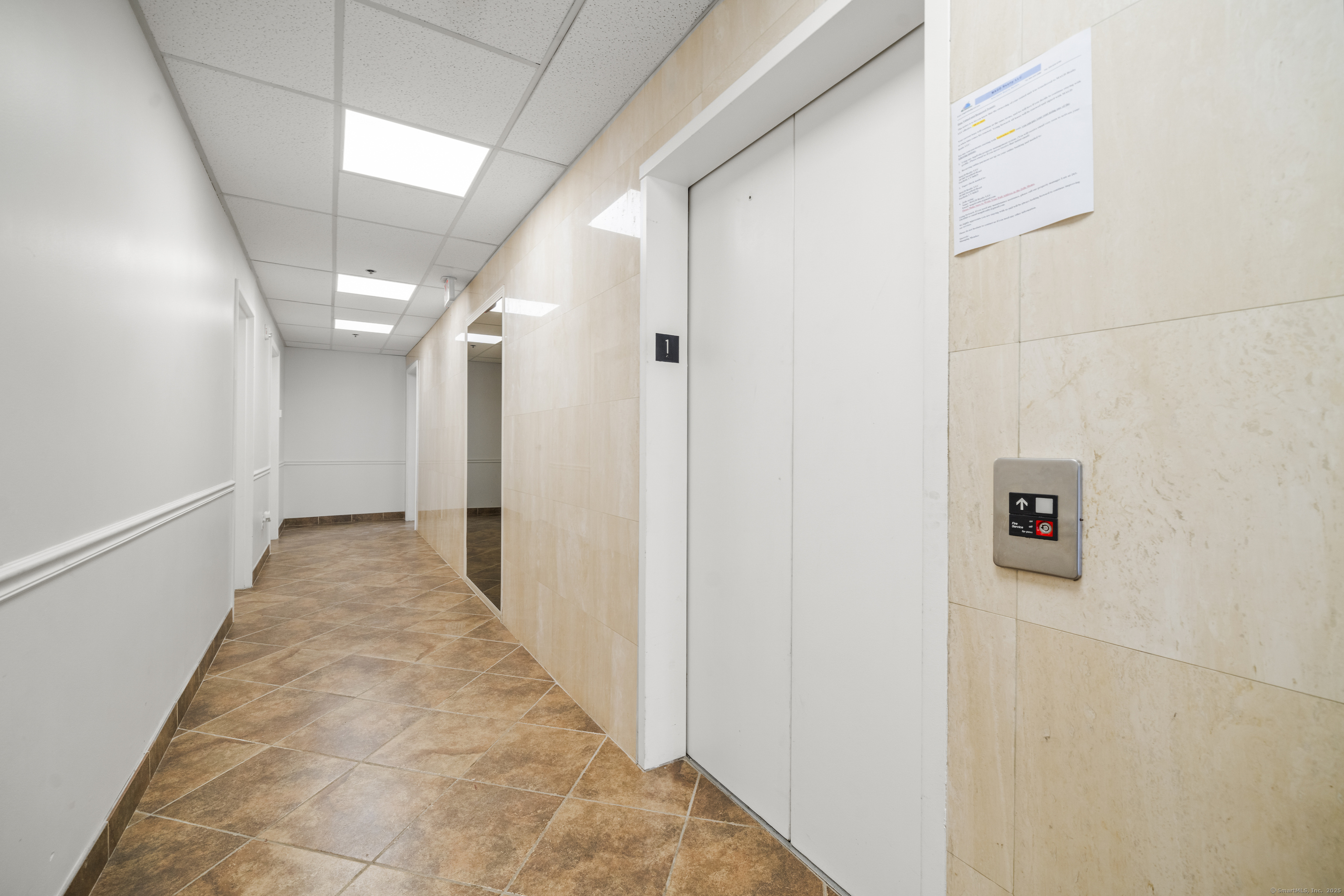 158 Main Street Ansonia, CT 06401 - Photo 21 of 26 a view of a hallway with wooden floor