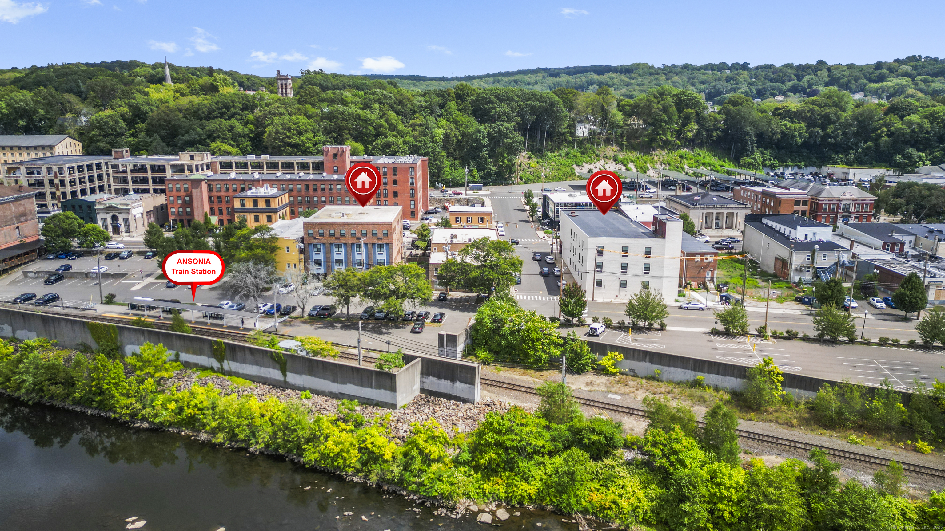 158 Main Street Ansonia, CT 06401 - Photo 4 of 26 an aerial view of a house with a garden and lake view