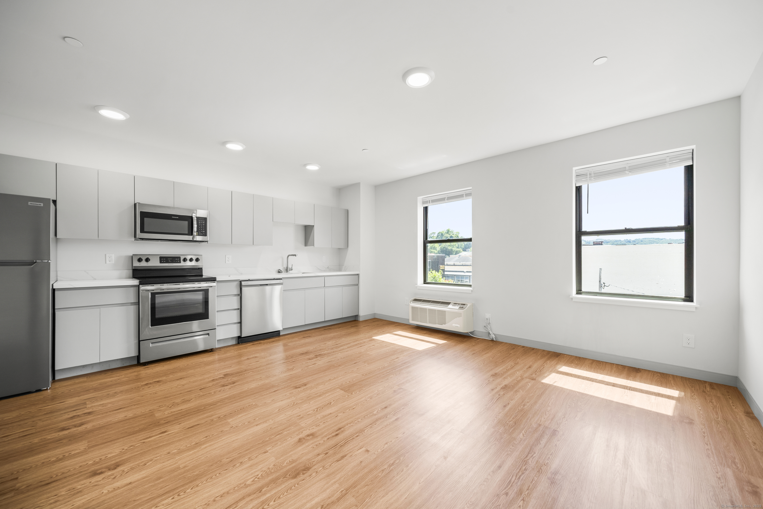 158 Main Street Ansonia, CT 06401 - Photo 10 of 26 a kitchen with stainless steel appliances a refrigerator sink and microwave