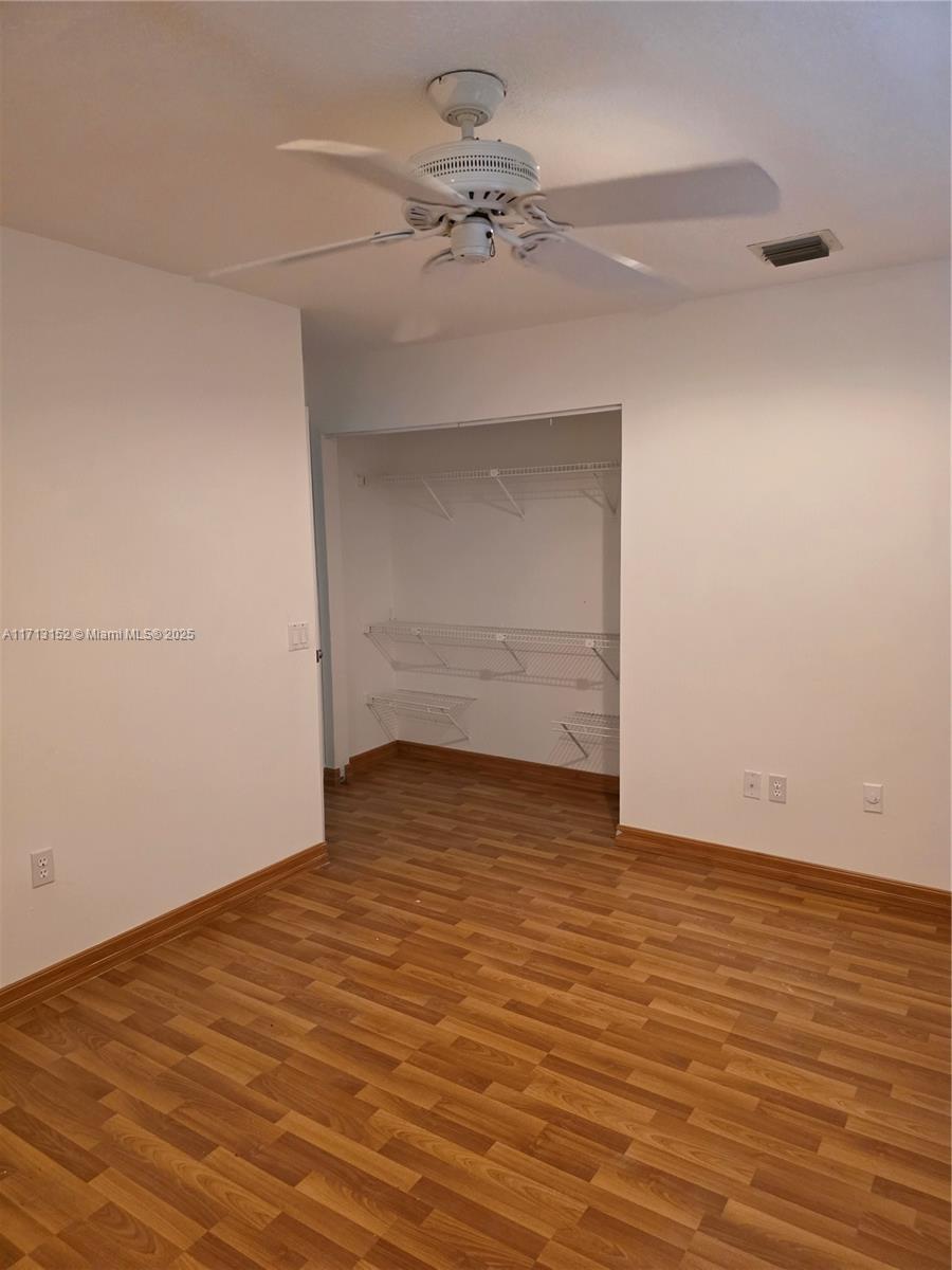 14630 Southwest 148th Court Miami, FL 33196 - Photo 12 of 15 wooden floor in an empty room