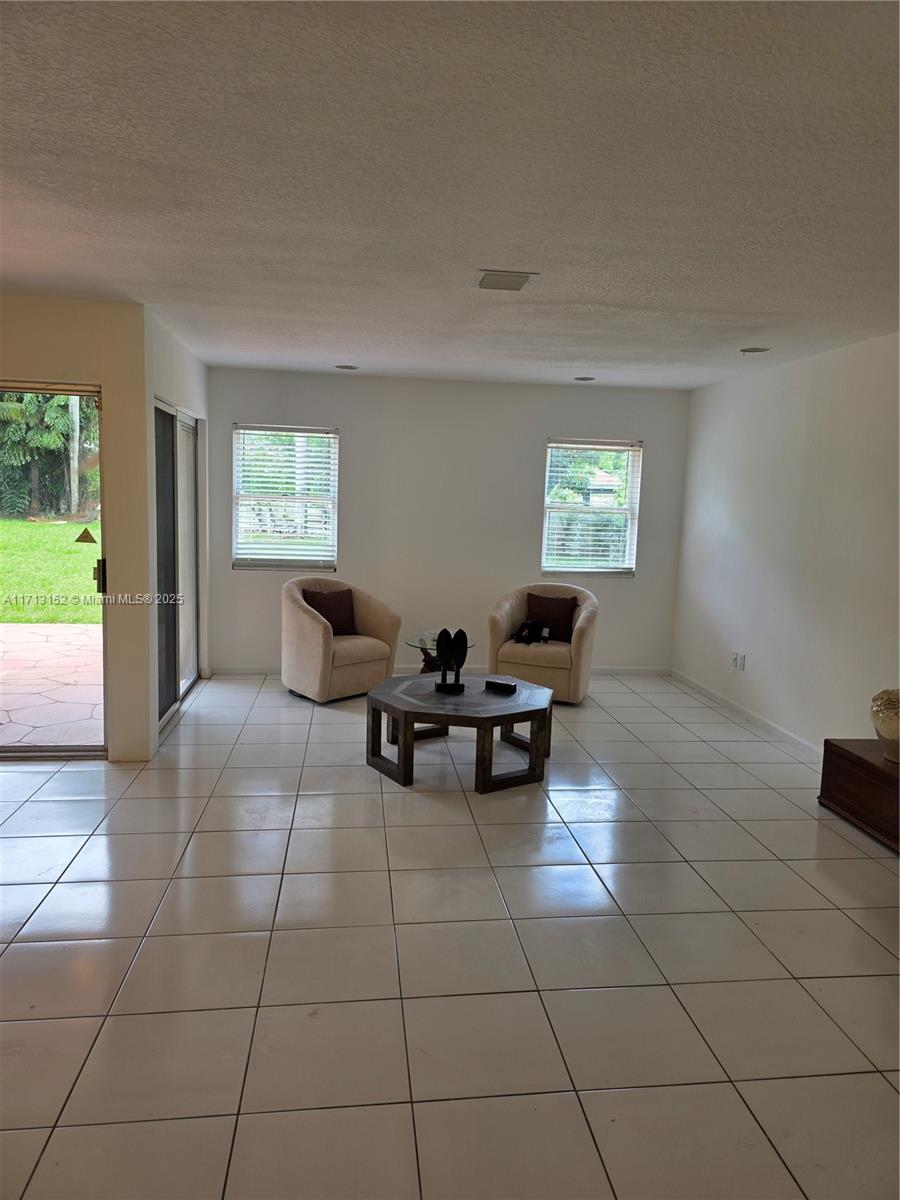 14630 Southwest 148th Court Miami, FL 33196 - Photo 3 of 15 a living room with furniture and a window