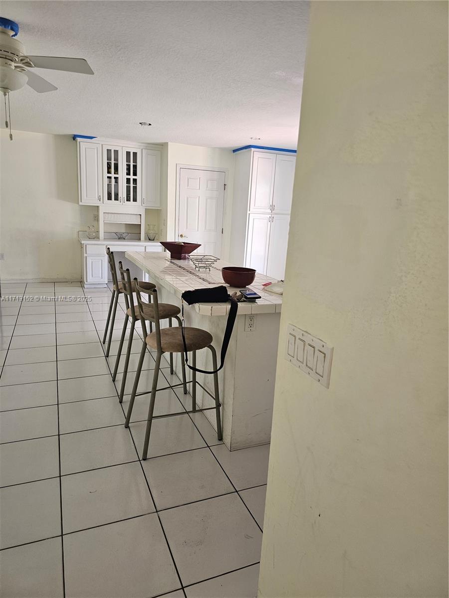 14630 Southwest 148th Court Miami, FL 33196 - Photo 6 of 15 a view of a livingroom with furniture and window
