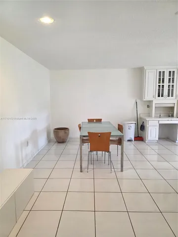 a work room with furniture and a table