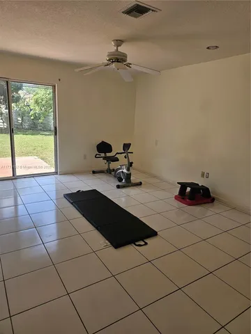 a room with a table and a fireplace