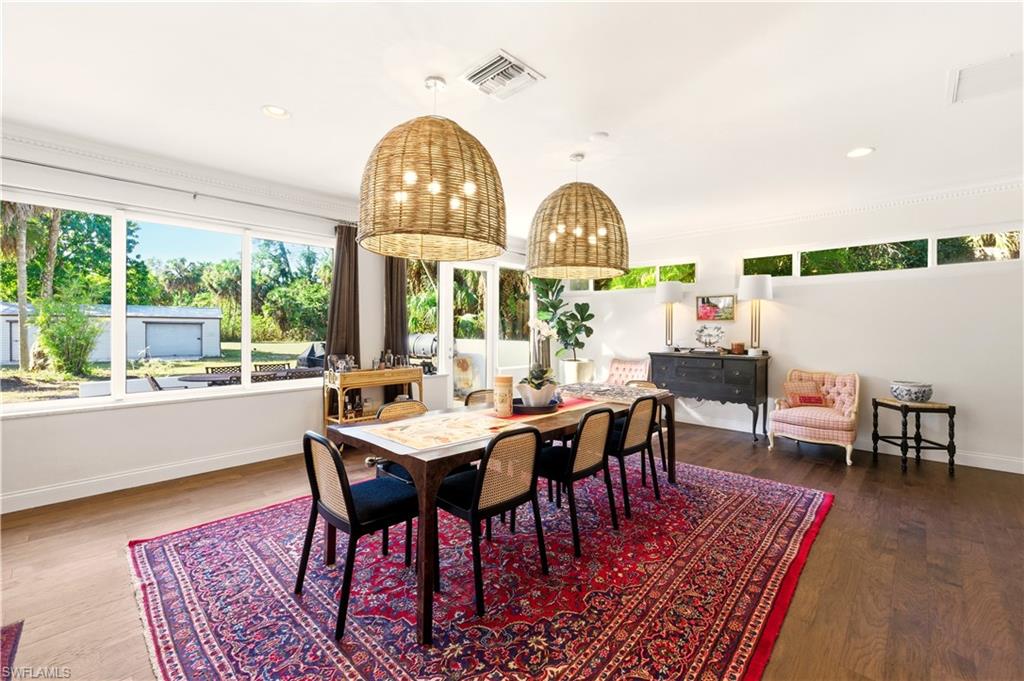 4630 11th Avenue Southwest Naples, FL 34116 - Photo 17 of 50 a view of a dining room with furniture window and wooden floor