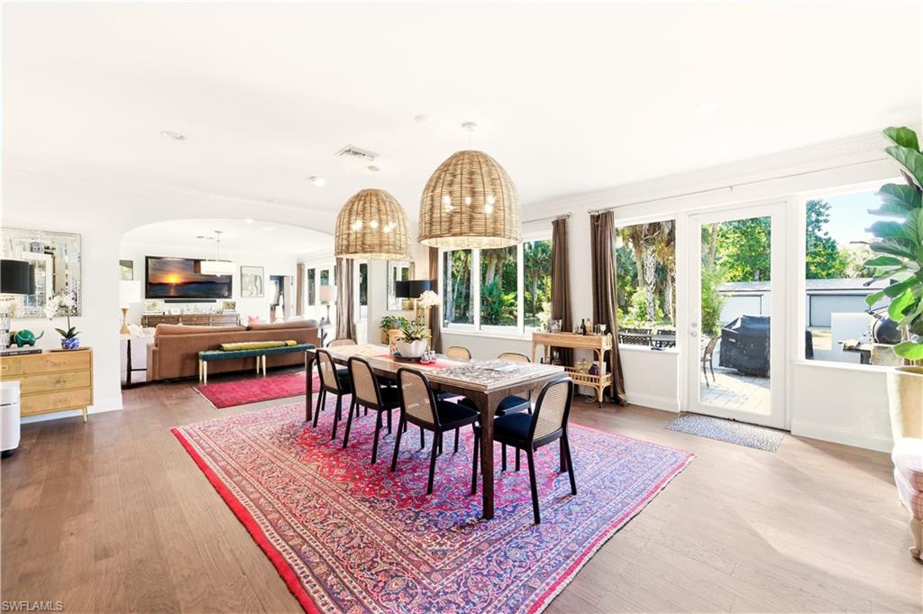 4630 11th Avenue Southwest Naples, FL 34116 - Photo 18 of 50 a view of a livingroom with furniture water view and large windows