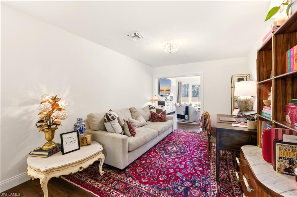 4630 11th Avenue Southwest Naples, FL 34116 - Photo 21 of 50 a living room with furniture and a flat screen tv