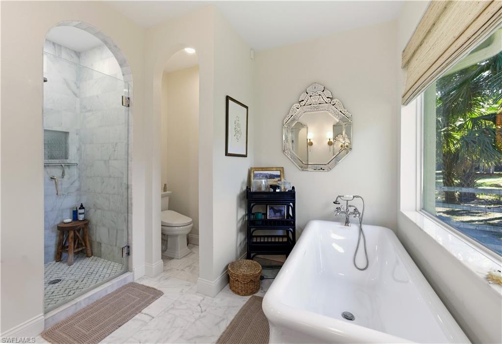 4630 11th Avenue Southwest Naples, FL 34116 - Photo 26 of 50 a bathroom with a sink and a mirror