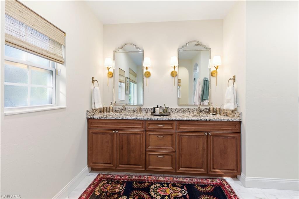 4630 11th Avenue Southwest Naples, FL 34116 - Photo 27 of 50 a bathroom with a sink and a mirror