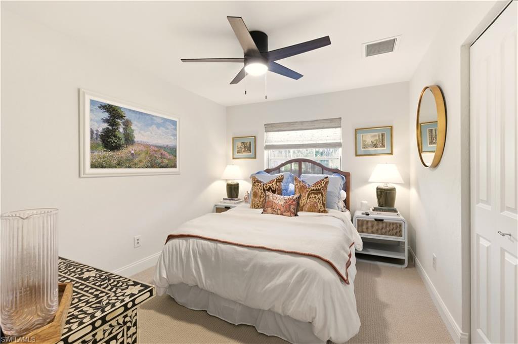 4630 11th Avenue Southwest Naples, FL 34116 - Photo 28 of 50 a bedroom with a bed and window