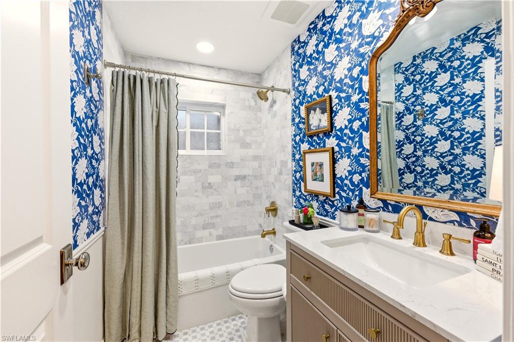 4630 11th Avenue Southwest Naples, FL 34116 - Photo 30 of 50 a bathroom with a sink toilet and shower