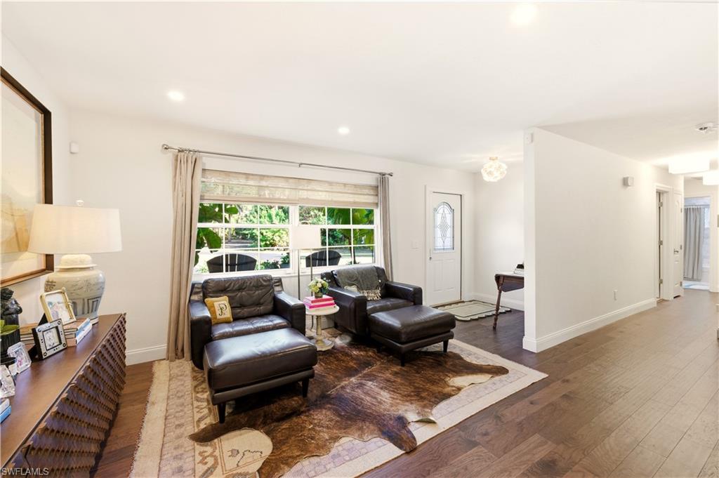 4630 11th Avenue Southwest Naples, FL 34116 - Photo 33 of 50 a living room with furniture and a window