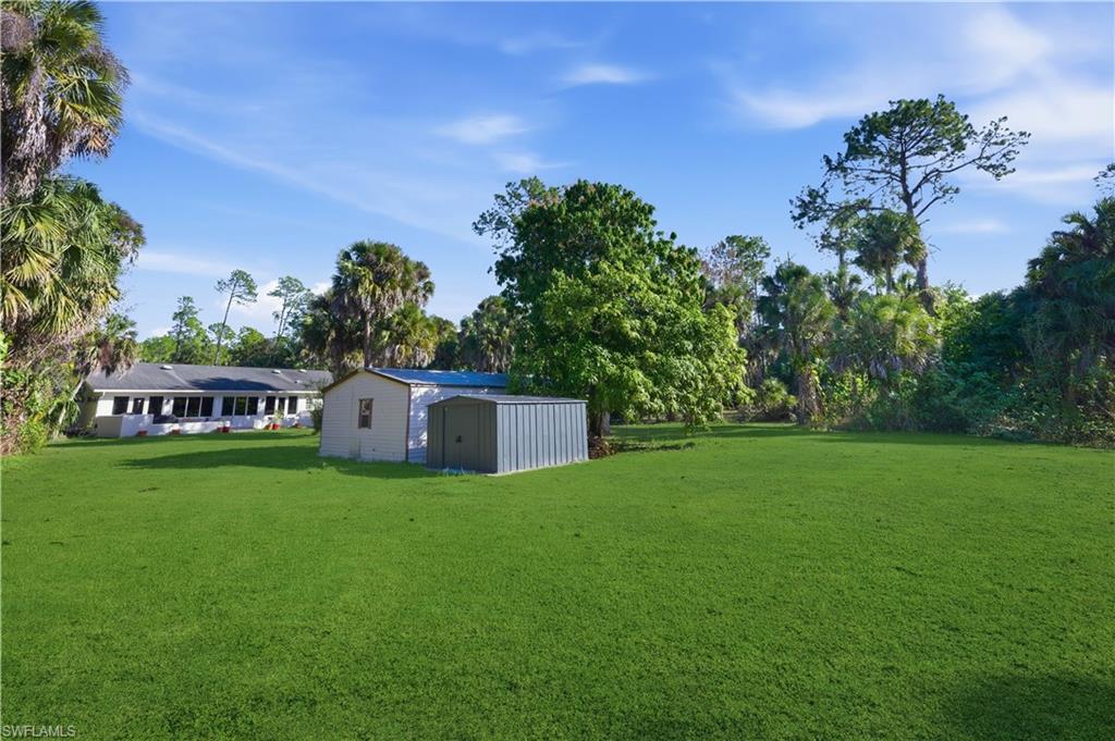 4630 11th Avenue Southwest Naples, FL 34116 - Photo 42 of 50 a view of a house with a yard