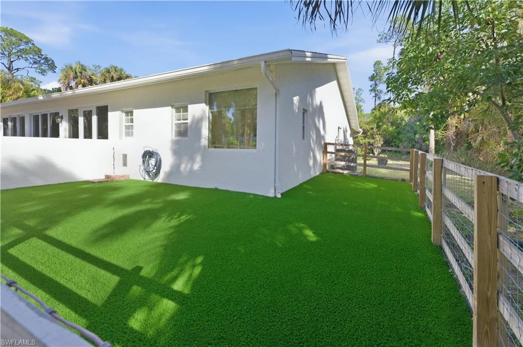 4630 11th Avenue Southwest Naples, FL 34116 - Photo 44 of 50 a view of a house with a yard