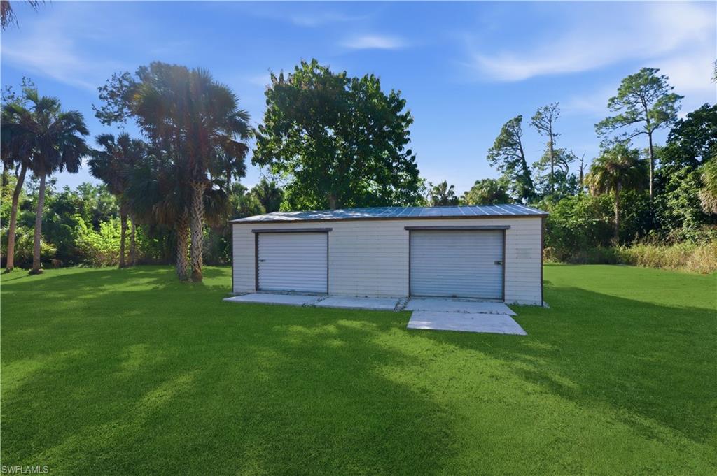 4630 11th Avenue Southwest Naples, FL 34116 - Photo 45 of 50 a view of a back yard of the house