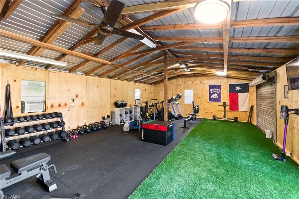4630 11th Avenue Southwest Naples, FL 34116 - Photo 46 of 50 a view of gym room with gym equipment